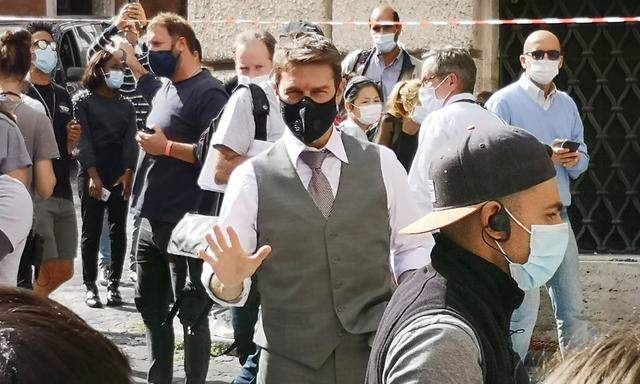 Italy: Tom Cruise on the set of Mission Impossible Tom Cruise greets fans during a break in filming of Mission Impossibl