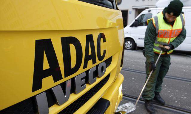 German police officer checks ADAC car before start of 50th Conference on Security Policy in Munich