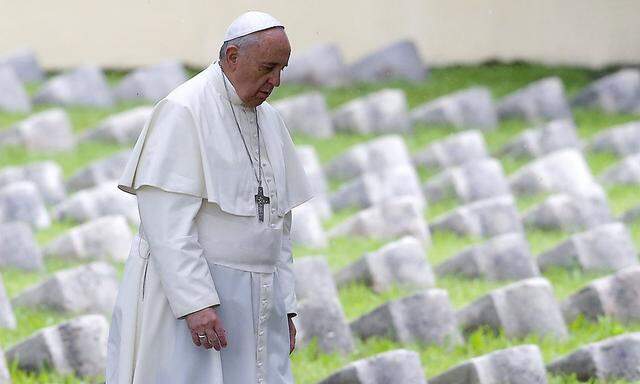 Pope Francis walks inside the Austro-Hungarian cemetery at Fogliano in Redipuglia