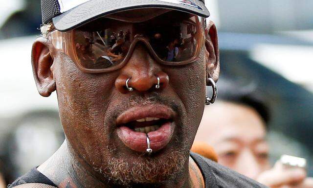 FILE PHOTO: Former NBA basketball player Rodman leaves Beijing airport after arriving from North Korea's Pyongyang