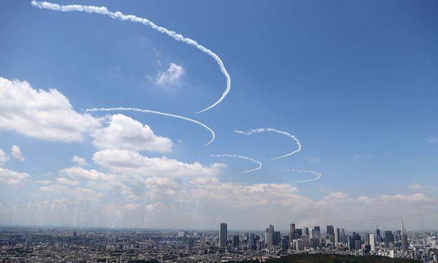 Blue Impulse skywrite Olympic rings in practice run for Games opening ceremony in Tokyo