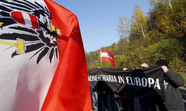 Protesters take part in an anti-migrant rally at the Spielfeld border crossing with Slovenia, in Austria 