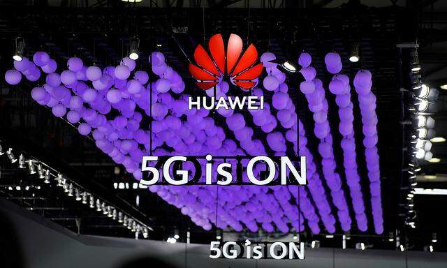 A Huawei logo and a 5G sign are pictured at Mobile World Congress (MWC) in Shanghai