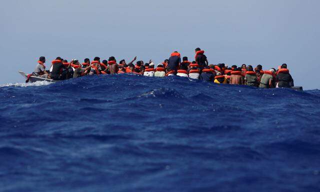 NGO migrant rescue ship Sea-Watch 3 and Italian Coast Guard rescue migrants in the Mediterranean