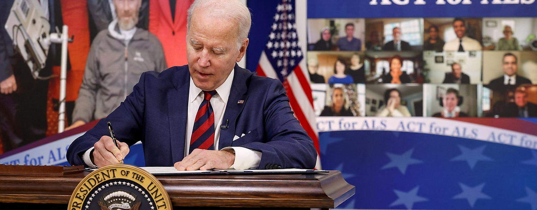 U.S. President Joe Biden signs the ACT for ALS Act at the White House in Washington