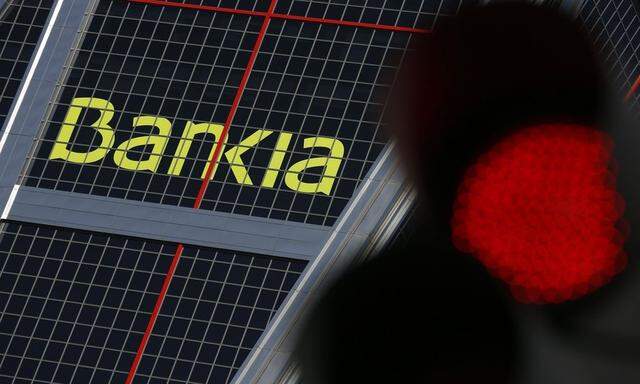 The headquarters of Spanish lender Bankia is pictured beside a red traffic light in Madrid