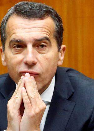 Austria's Chancellor Kern listens during a session of the parliament in Vienna