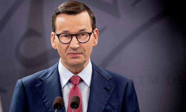 FILE PHOTO: Denmark's Prime Minister Mette Frederiksen and Poland's Prime Minister Mateusz Morawiecki attend a news conference, in Copenhagen