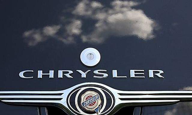 Clouds are reflected on a Chrysler PT Cruiser at a Chrysler dealership in Rome