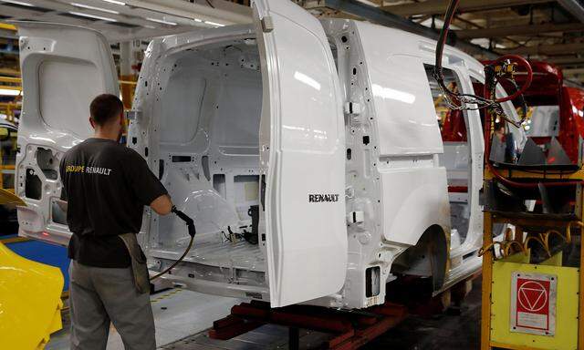 An employee works on the production and quality control line of the Renault Kangoo car at the Renault Maubeuge Construction Automobile factory in Maubeuge