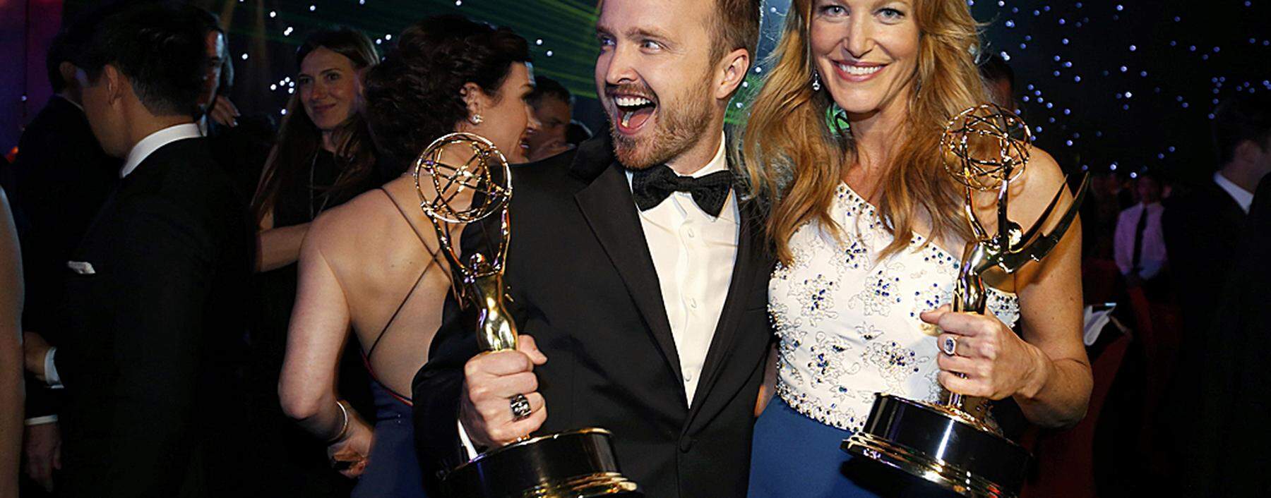 Aaron Paul with his Outstanding Supporting Actor in a Drama Series award and Anna Gunn with her Outstanding Supporting Actress in a Drama Series award attend the Governors Ball for the 66th Primetime Emmy Awards in Los Angeles