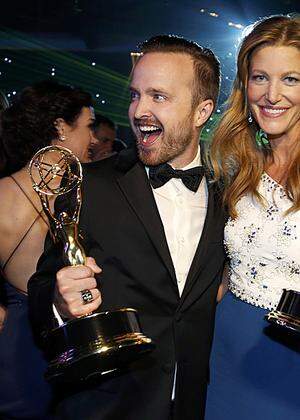 Aaron Paul with his Outstanding Supporting Actor in a Drama Series award and Anna Gunn with her Outstanding Supporting Actress in a Drama Series award attend the Governors Ball for the 66th Primetime Emmy Awards in Los Angeles