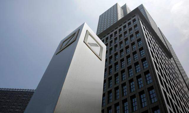 FILE PHOTO: Logos of Deutsche Bank AG are seen in Tokyo
