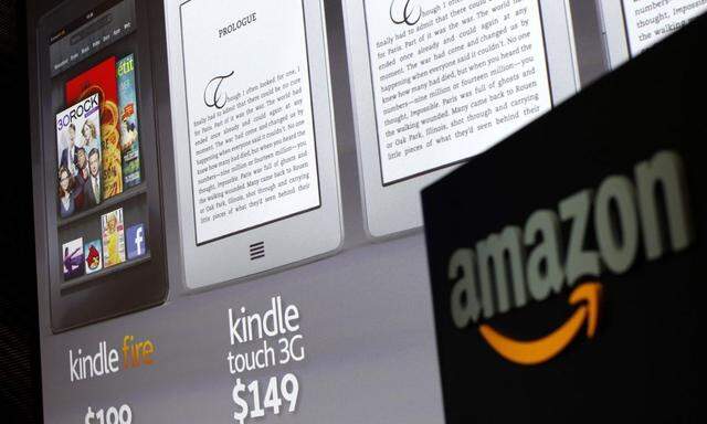 File photo of graphics of new Amazon Kindle tablets at news conference in New York