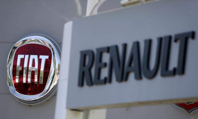 FILE PHOTO: The logos of Renault and Fiat carmakers are seen in Nice