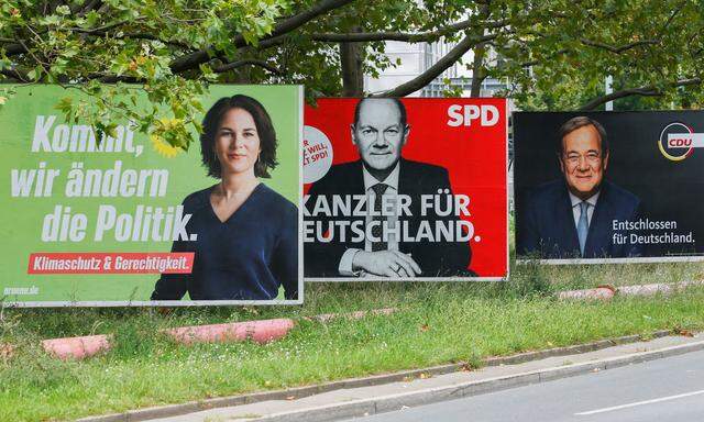 Top candidates for the German Chancellery feature on election campaign billboards