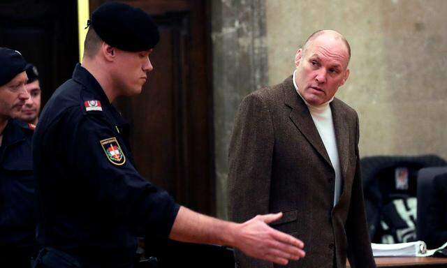 Former Austrian two-time Olympic judo champion Peter Seisenbacher arrives for his trial at a court in Vienna