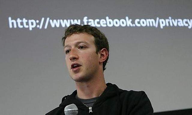 Facebook CEO Mark Zuckerberg responds to a question during a news conference at Facebook headquarters