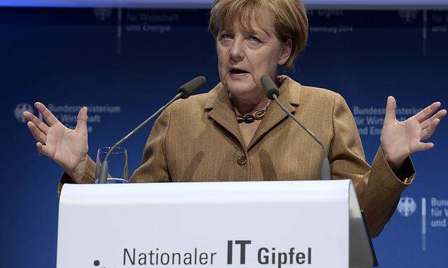 German Chancellor Merkel delivers her speech at the ´National IT Summit´ at the chamber of commerce in Hamburg