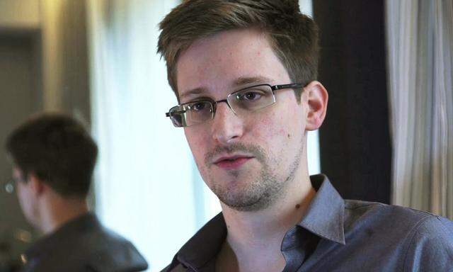 File photo of NSA whistleblower Edward Snowden being interviewed by The Guardian in his hotel room in Hong Kong