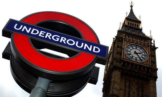 A London Underground tube station sign in front of Parliament in London