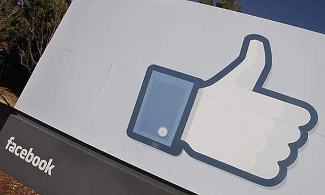 The Facebook logo is displayed outside of Facebooks new headquarters in Menlo Park, Calif., Thursday