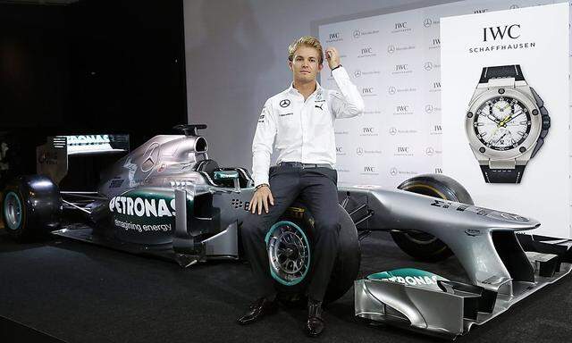 Mercedes Formula One driver Nico Rosberg of Germany poses during a promotional event in Tokyo
