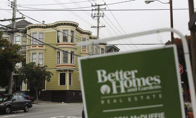 A real state sign is seen near a row of homes in the Haight Ashbury neighborhood in San Francisco