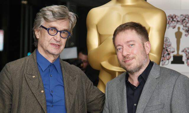 Filmmakers Wim Wenders (L) and Juliano Ribeiro Salgado (R) from the Oscar-nominated documentary feature ´The Salt of the Earth´ pose at a reception ahead of the upcoming 87th Academy Awards ceremony in Beverly Hills, California