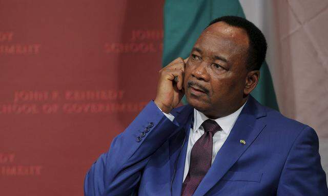 Issoufou Mahamadou, President of Niger, listens to a translation as he is introduced to speak at the John F. Kennedy School of Government at Harvard University in Cambridge
