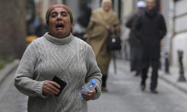 A woman reacts following a suicide bombing in central Istanbul