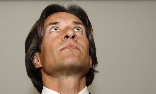 Former Austrian Finance Minister Grasser waits at court in Vienna