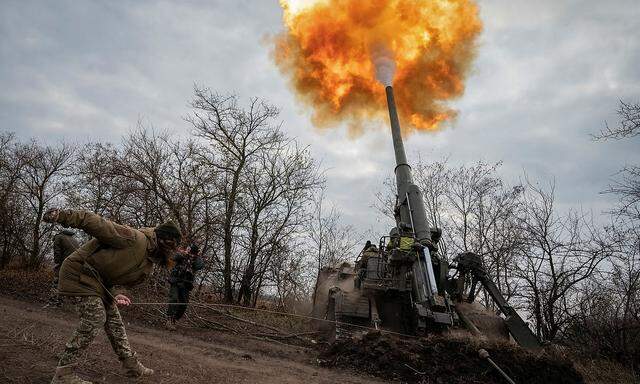 Ukrainian servicemen fire a 2S7 Pion self-propelled gun at a position on a frontline in Kherson region