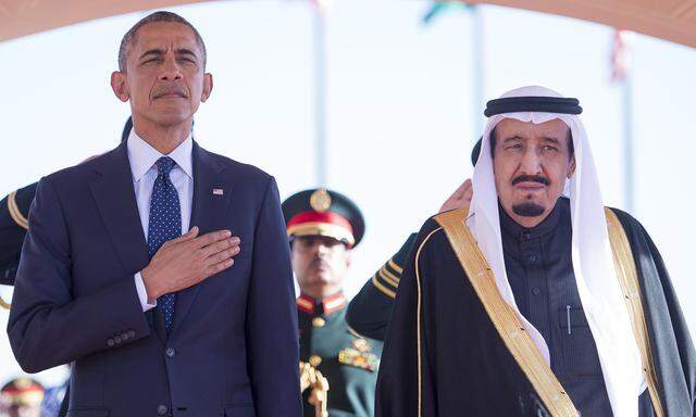 U.S. President Barack Obama stands with Saudi Arabia´s King Salman after arriving in Riyadh