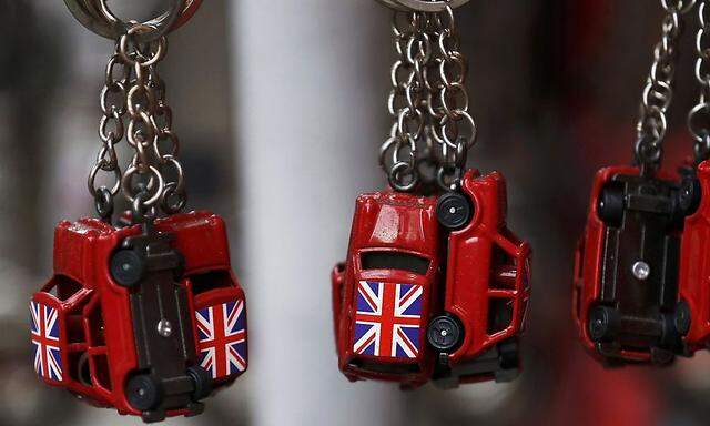 Union flags are painted onto car shaped keyrings for sale in London, Britain