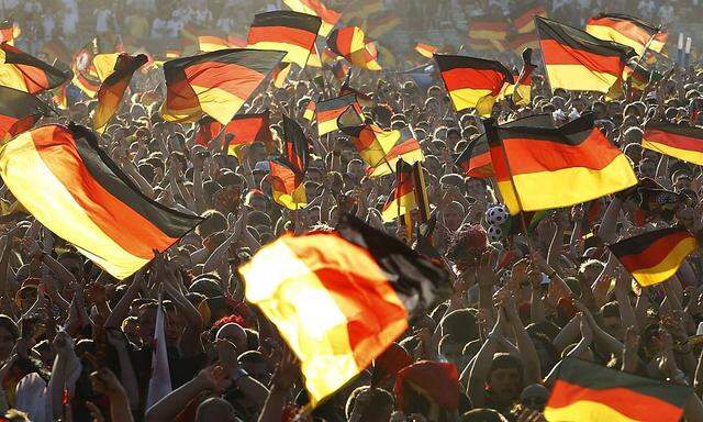 Soccer fans cheer as they watch 2010 World Cup semi-final match between Germany and Spain at public viewing in Hamburg