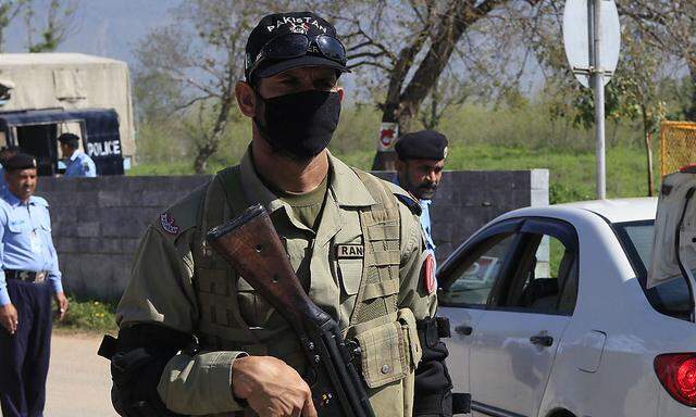Paramilitary soldier stands guard outside a special court formed to try Musharraf in Islamabad