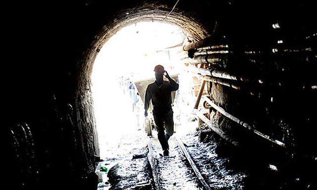 An independent miner enters the Pailaviri zinc-tin mine at the famous Cerro Rico mountain in Potosi, 