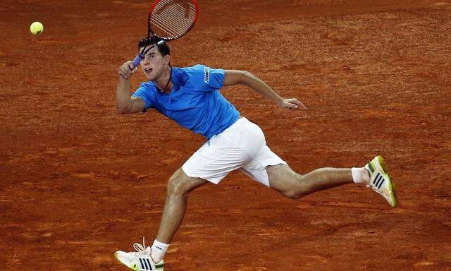 Thiem of Austria returns the ball to Wawrinka of Switzerland during their match at the Madrid Open tennis tournament