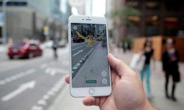 Photo illustration of a 'Pidgey' Pokemon seen on the screen of the Pokemon Go mobile app 