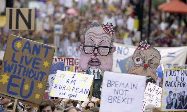 People hold banners during a demonstration against Britain's decision to leave the European Union, in central London