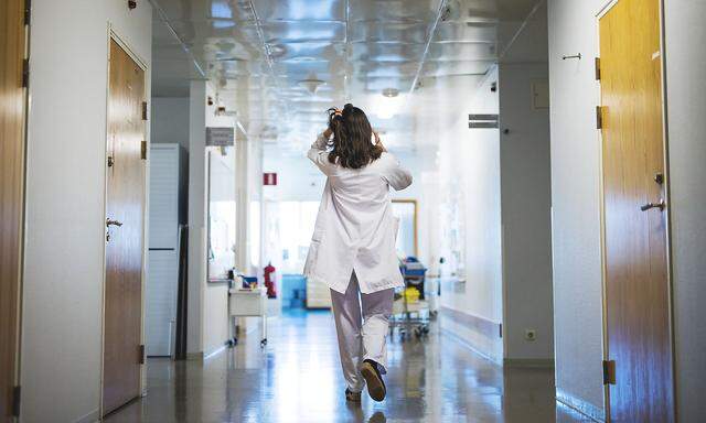 Doctor walking through hospital corridor