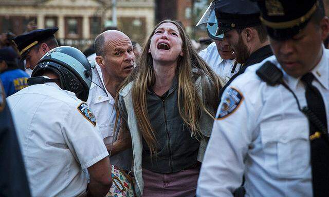 A protester is detained by New York police during a demonstration calling for social, economic and racial justice, in the Manhattan borough of New York City