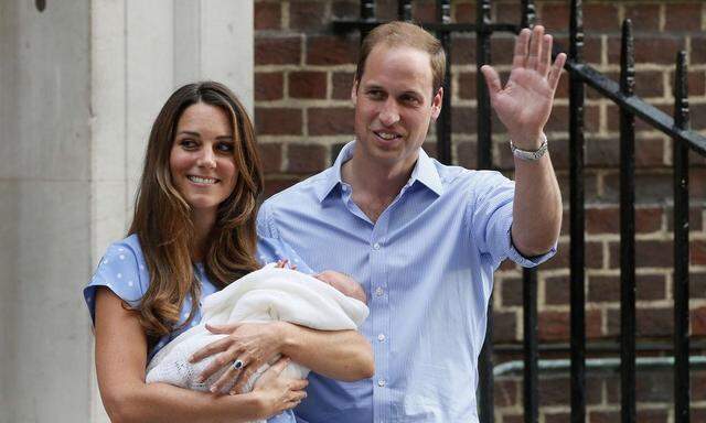 File photograph of Britain's Prince William and his wife Catherine, Duchess of Cambridge with their baby son, outside the Lindo Wing of St Mary's Hospital, in central London