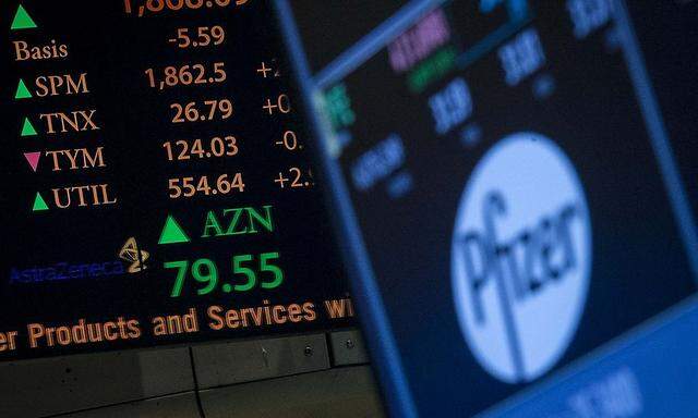 The ticker symbol for AstraZeneca is displayed next to a ticker for Pfizer on the floor of the New York Stock Exchange