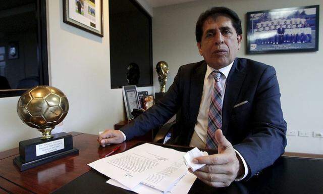 Brayan Jimenez, president of Guatemala's soccer association, sits at a desk in Guatemala City