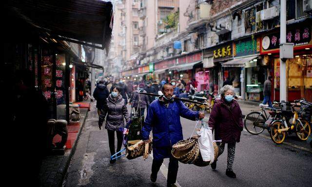 Ein Jahr nach dem Lockdown ist auf Wuhans Tagelöhnermarkt nur mehr wenig von Krisenstimmung zu spüren.