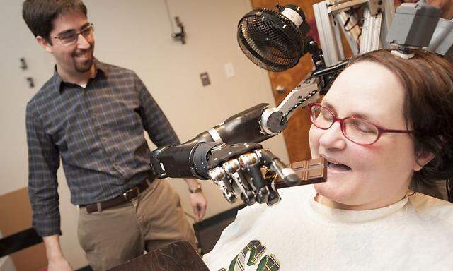 Undated photo showing paralysed woman demonstrating use of new mind-controlled prosthetic arm with intuitive control in Pittsburgh