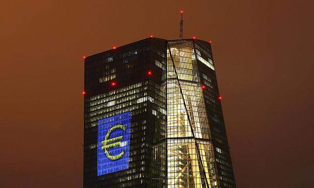 Headquarters of the European Central Bank (ECB) is seen illuminated with a giant euro sign at the start of the 'Luminale, light and building' event in Frankfurt