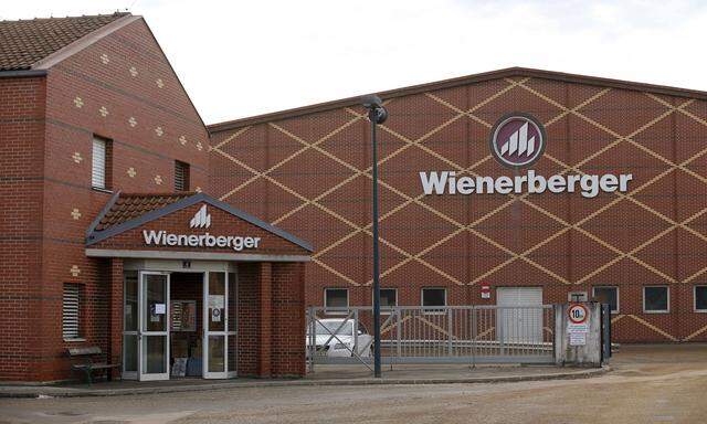 Logos of Wienerberger, the world's biggest brickmaker, are pictured at its headquarters in Hennersdorf